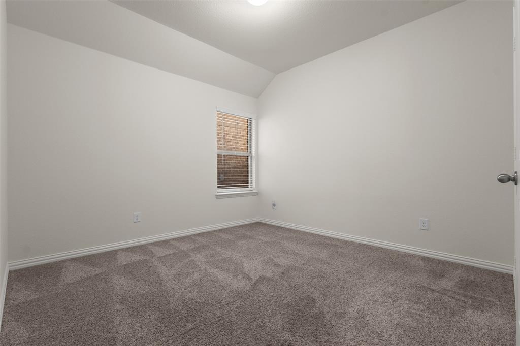 1740 Rio Costilla Road Fort Worth, TX 76131 - Photo 33 of 40 Neutral wall paint, textured carpet, window with blinds, white trim, and a ceiling light fixture