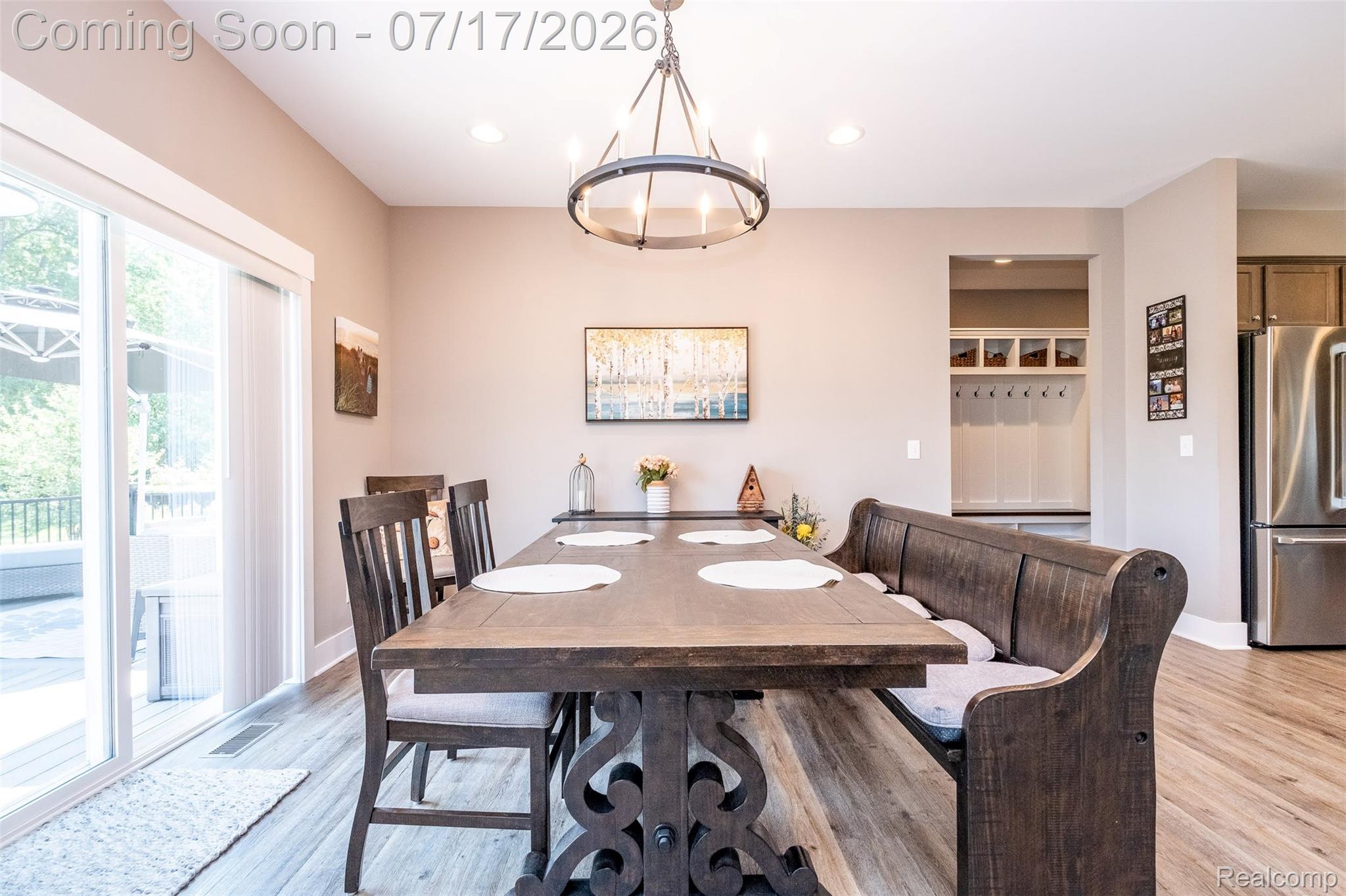 12349 Sugar Maple Drive Fenton, MI 48430 - Photo 11 of 67 Dining area featuring wood-finish flooring, a contemporary chandelier, and recessed lighting