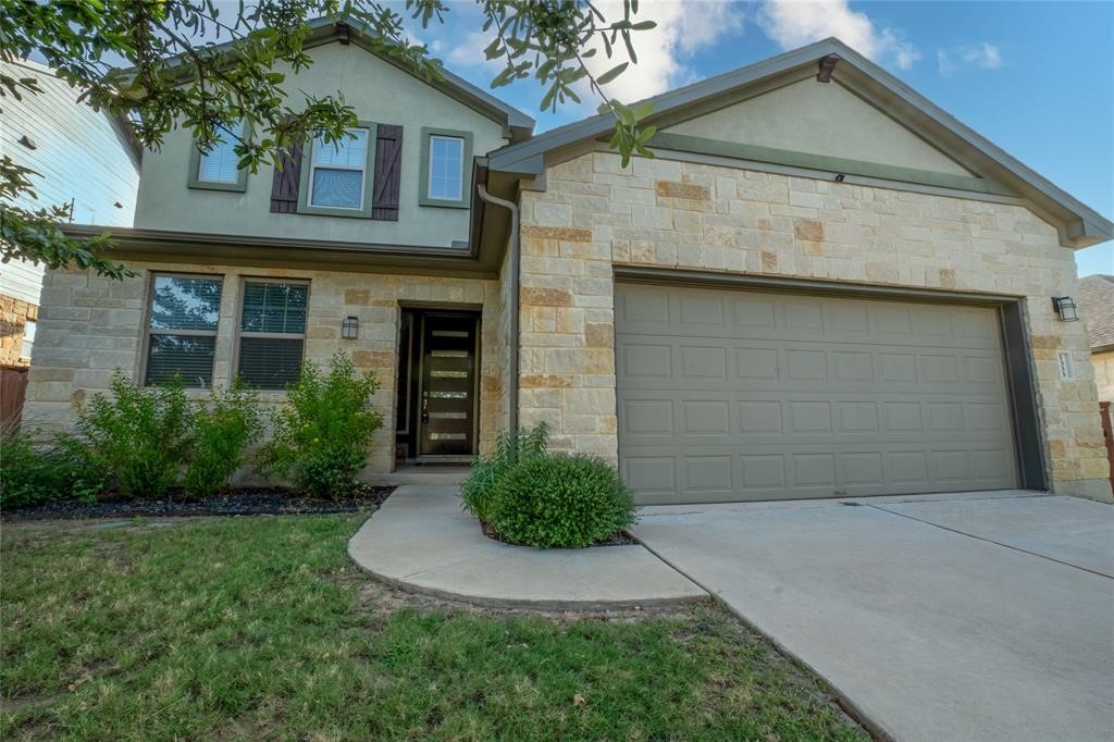 1333 Terrace View Drive Georgetown, TX 78628 - Photo 1 of 35 A traditional stone facade and integrated garage create an inviting curb appeal for this property.