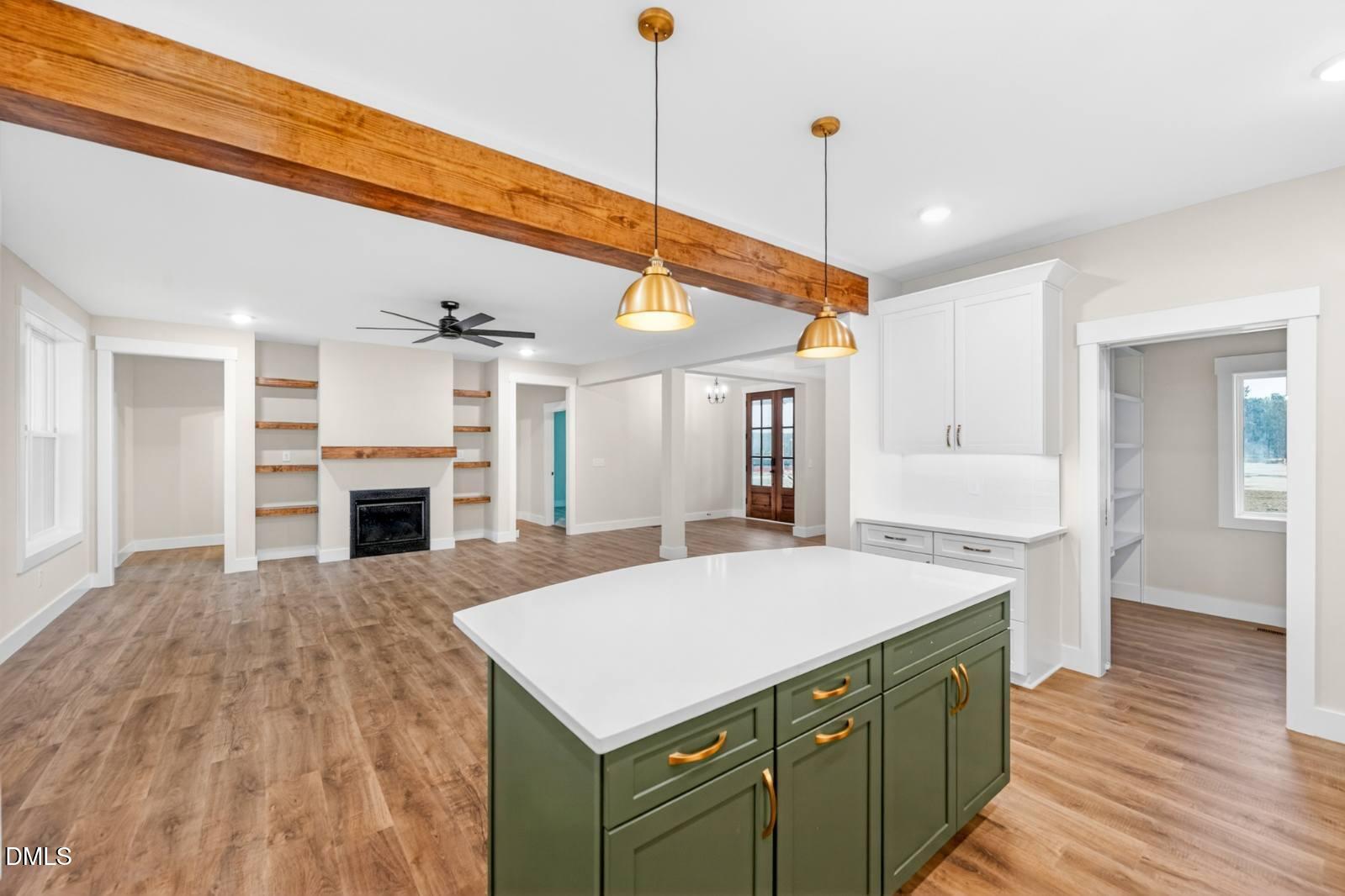 8 Trey Point Dr Spring Spring Hope, NC 27882 - Photo 9 of 31 a kitchen with a stove a refrigerator and a fireplace