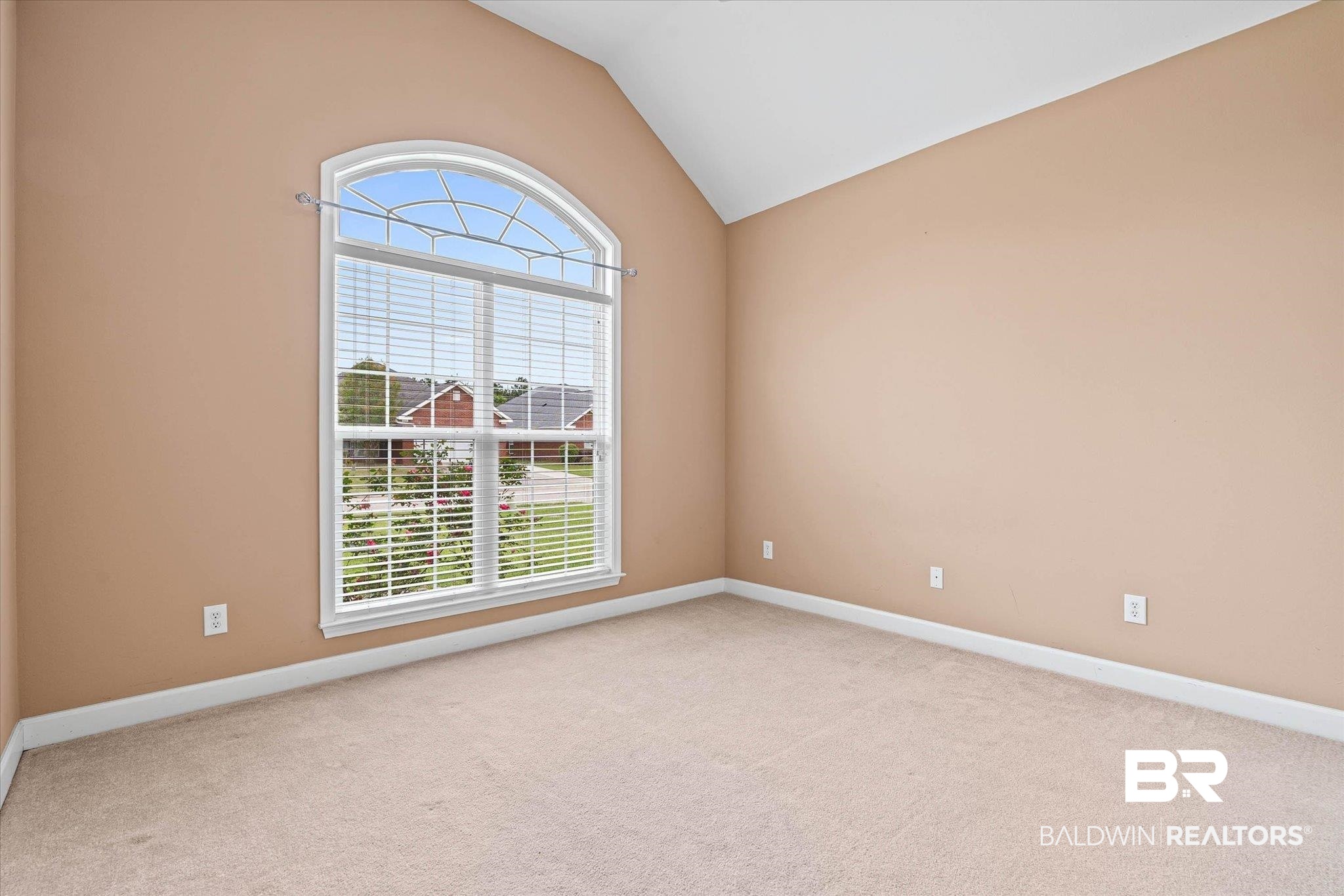 1003 Weatherby Street South Saraland, AL 36571 - Photo 19 of 31 Unfurnished room featuring light colored carpet and vaulted ceiling