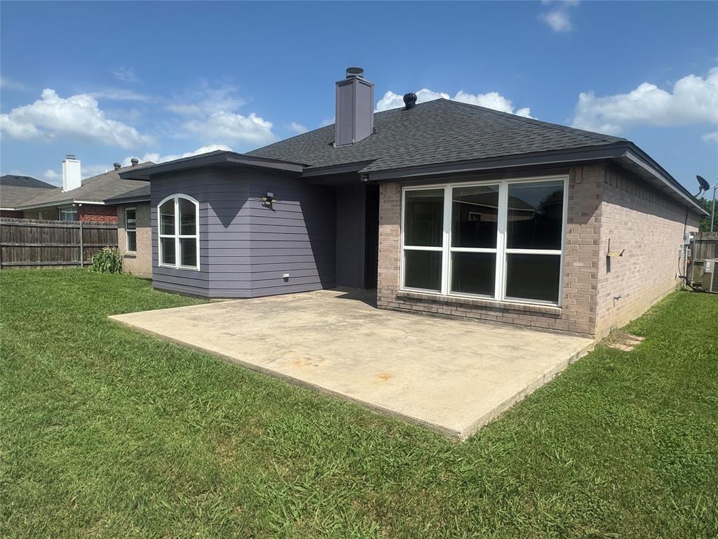 908 Cedar Ridge Lane Burleson, TX 76028 - Photo 23 of 24 a front view of a house with a garden