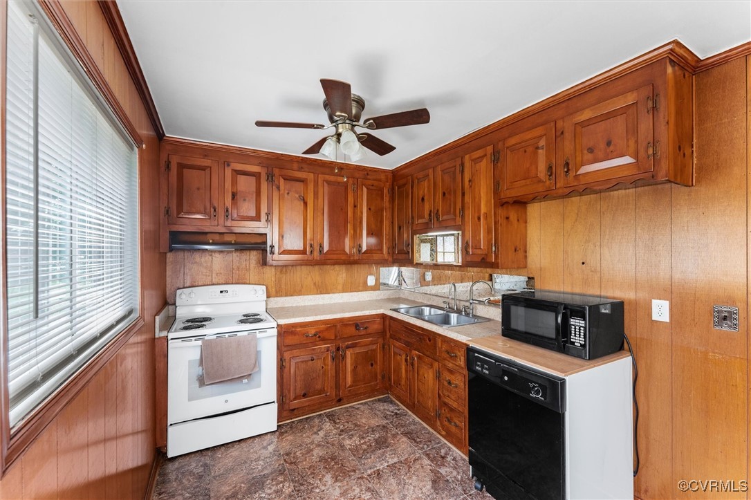 5425 Germain Road Richmond, VA 23224 - Photo 29 of 37 Kitchen featuring black appliances, light countert