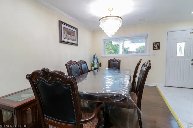 a view of a dining room with furniture and window