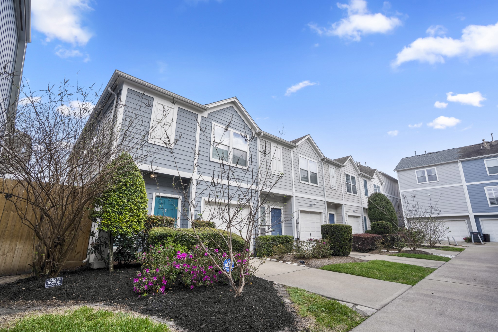 a front view of a building with garden
