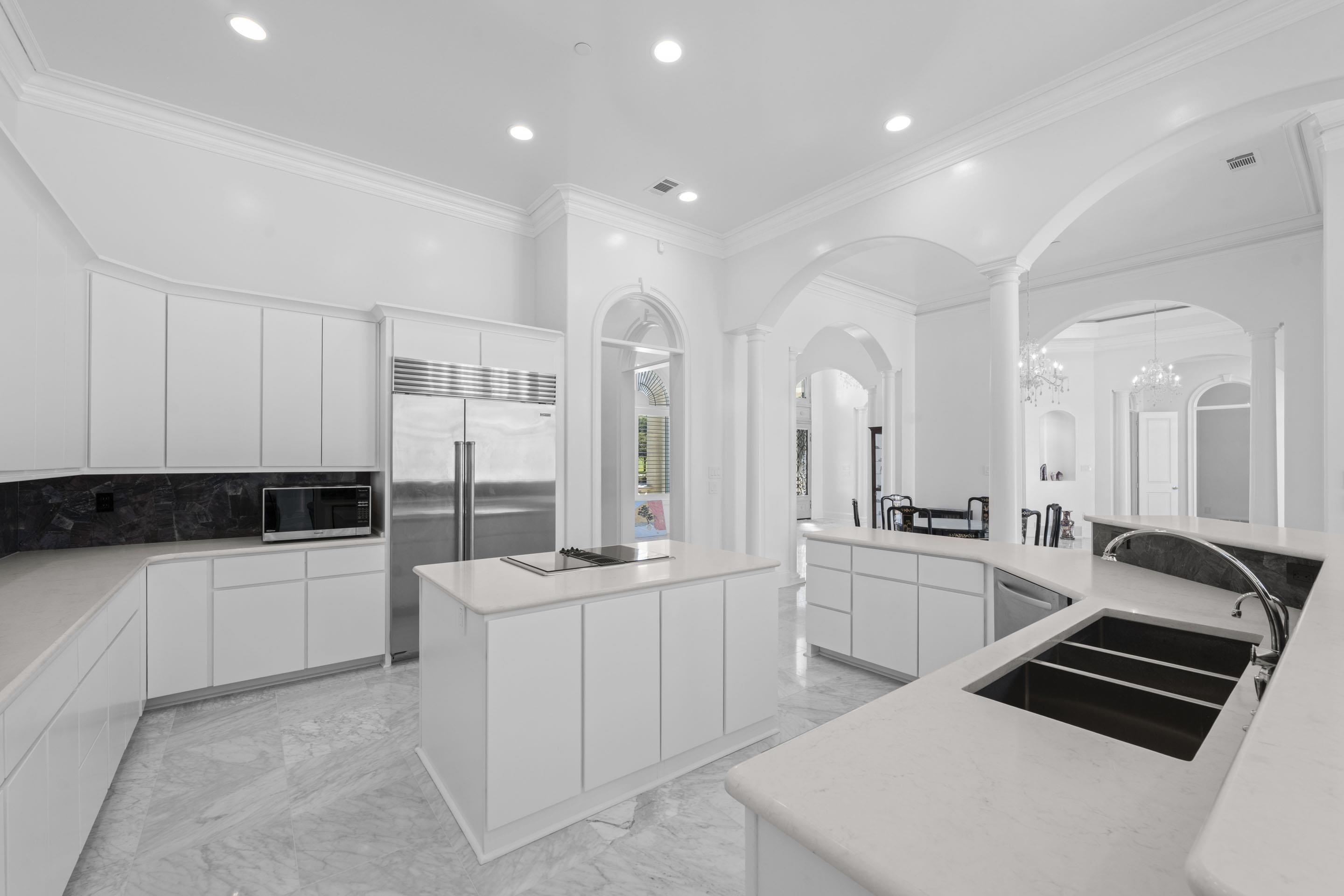 881 Bray Station Road Collierville, TN 38017 - Photo 6 of 40 Kitchen featuring light marble finish floors, stainless steel appliances, modern cabinets, ornamental molding, and white cabinets