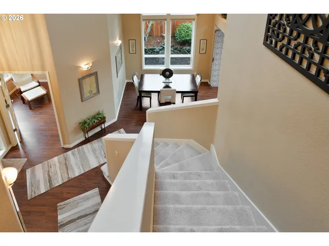 a view of living room with furniture and wooden floor