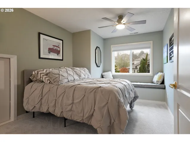 a bedroom with a bed and window