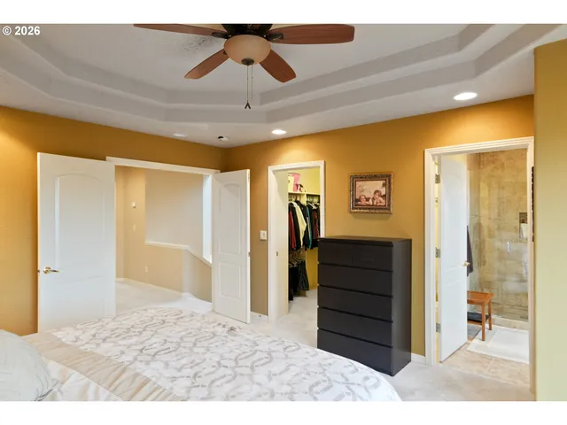 a view of a hallway to rooms