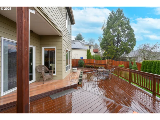 a view of house with patio outdoor seating and wooden floor