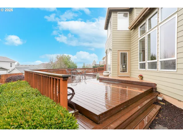 a view of a roof deck with wooden floor and fence