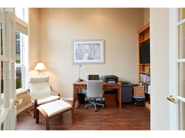 a work room with furniture and wooden floor
