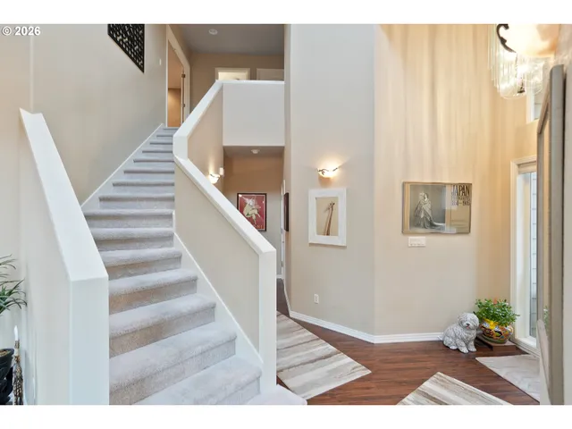a view of entryway with stairs and wooden floor