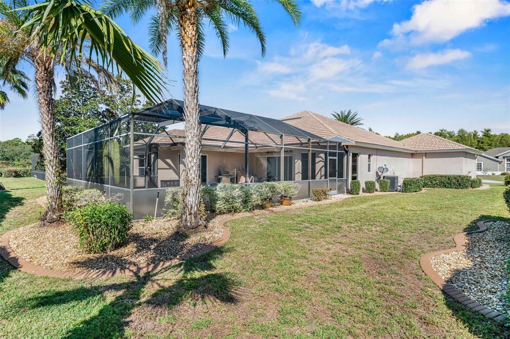 8426 Charleston Drive Weeki Wachee, FL 34613 - Photo 29 of 73 a front view of a house with a garden