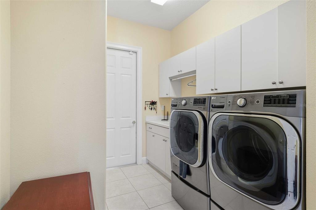 8426 Charleston Drive Weeki Wachee, FL 34613 - Photo 41 of 73 a utility room with dryer and washer