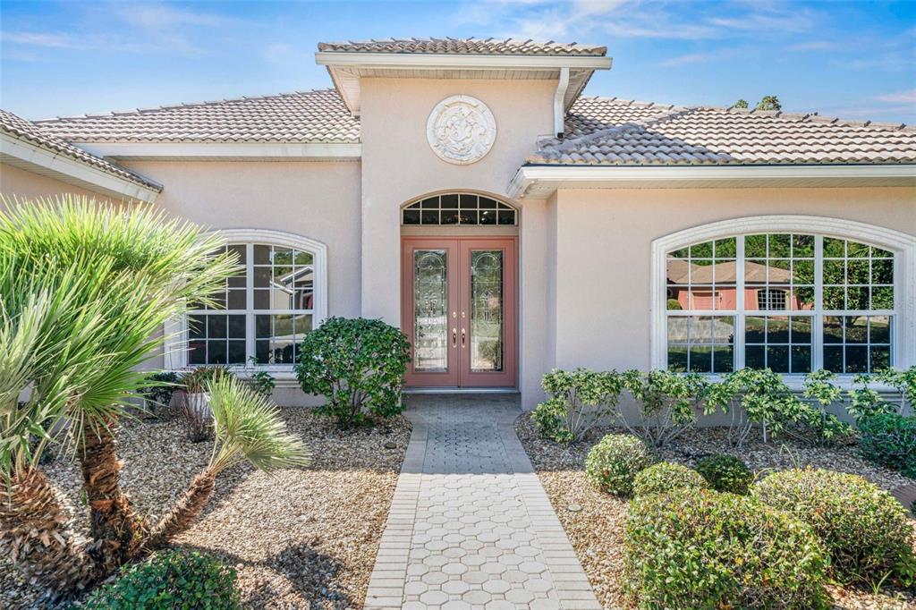 8426 Charleston Drive Weeki Wachee, FL 34613 - Photo 6 of 73 a front view of a house with garden
