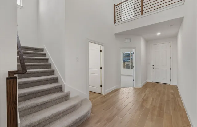 a view of an entryway with wooden floor