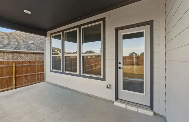 a view of a big room with wooden fence