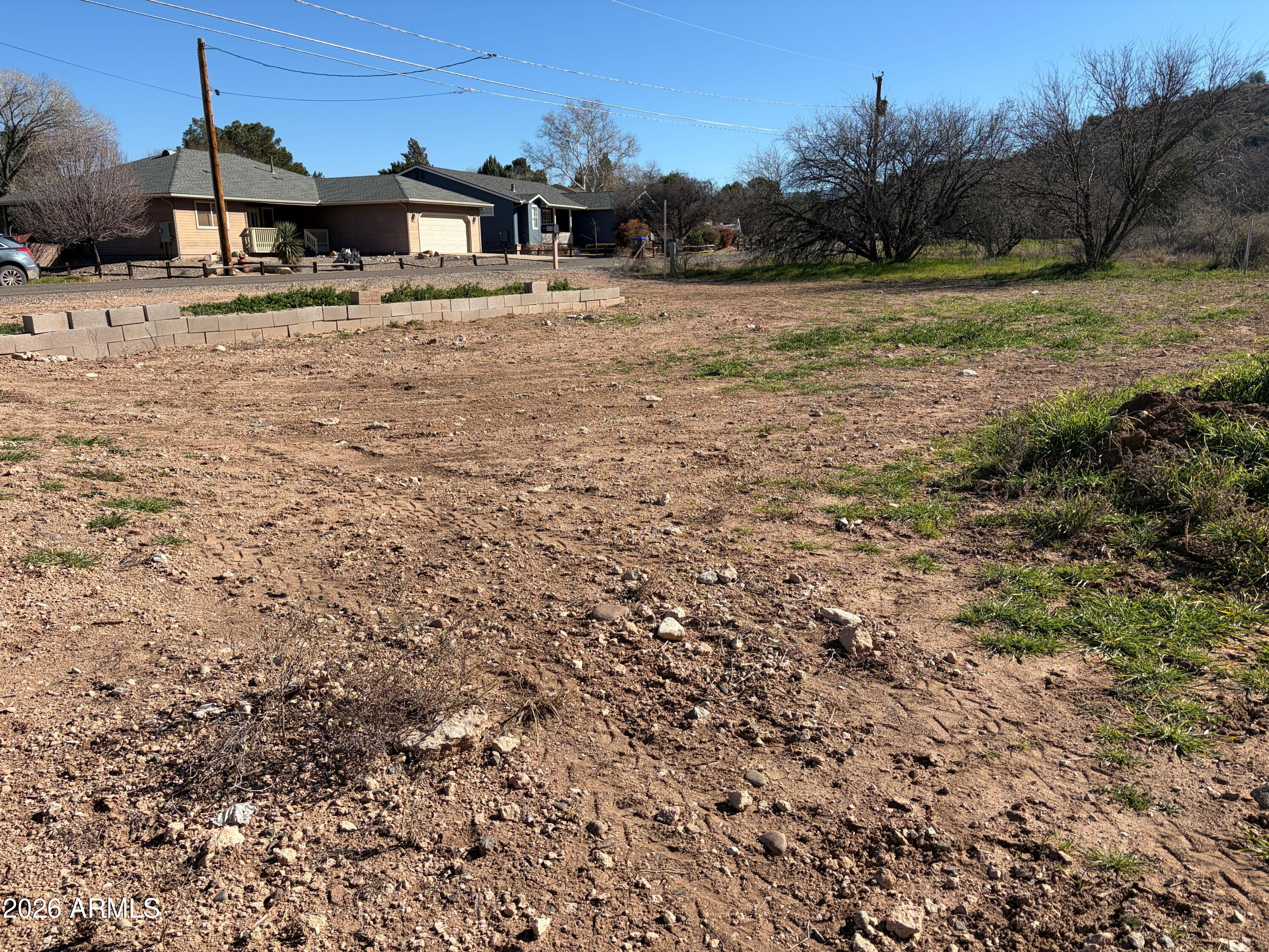 3545 East Montezuma Avenue, Unit 74 Rimrock, AZ 86335 - Photo 11 of 11 a view of a yard with wooden fence