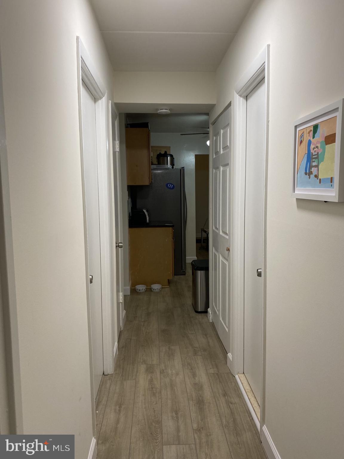 6220 Edsall Road, Unit 101 Alexandria, VA 22312 - Photo 3 of 6 a view of a hallway with wooden floor and closet