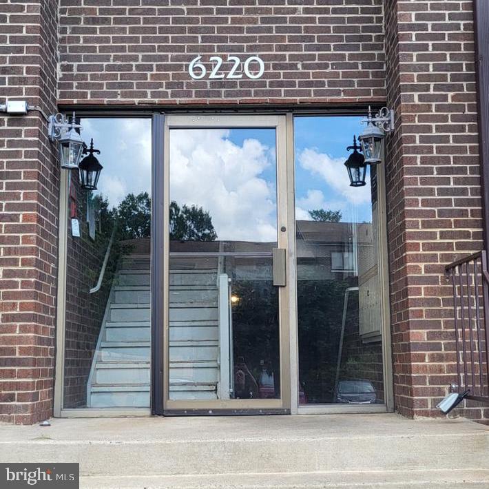6220 Edsall Road, Unit 101 Alexandria, VA 22312 - Photo 6 of 6 a view of a door and brick wall