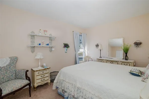 a bedroom with a bed and dresser