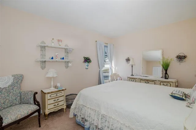 a bedroom with a bed and dresser