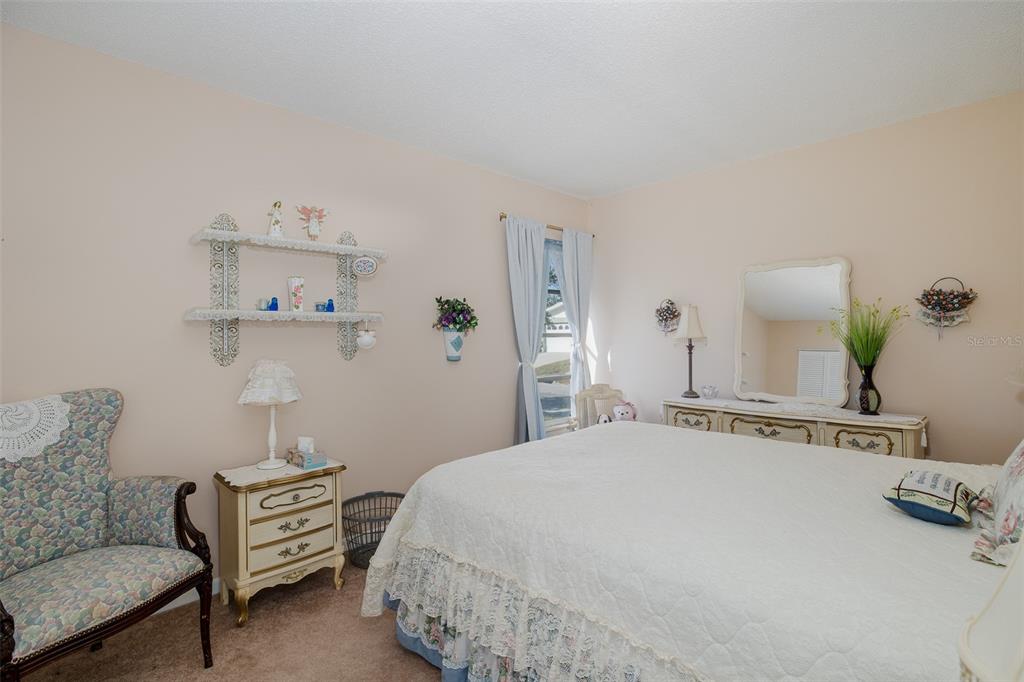8015 San Fernando Drive Port Richey, FL 34668 - Photo 11 of 46 a bedroom with a bed and dresser