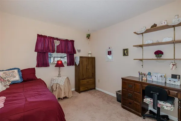 a bedroom with a bed and cabinets