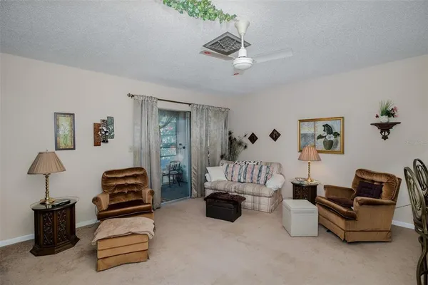 a bedroom with furniture and a lamp