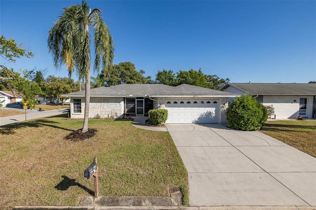 8015 San Fernando Drive Port Richey, FL 34668 - Photo 2 of 46 a view of a house with entertaining space