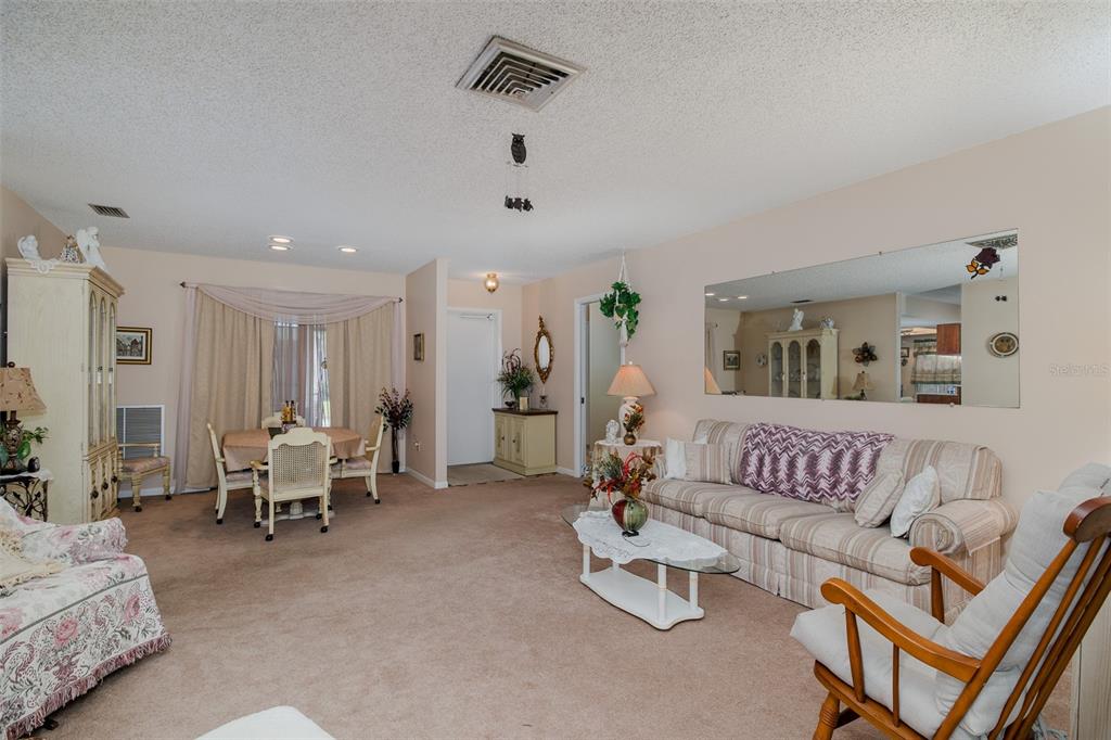 8015 San Fernando Drive Port Richey, FL 34668 - Photo 21 of 46 a living room with furniture and white walls