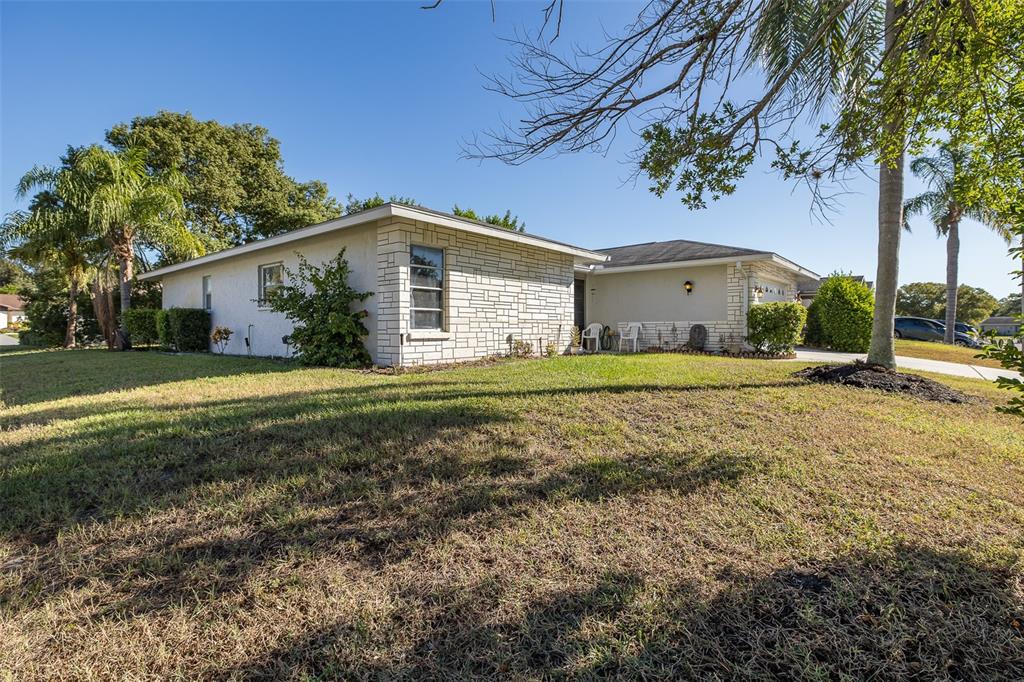 8015 San Fernando Drive Port Richey, FL 34668 - Photo 23 of 46 a view of a house with a yard