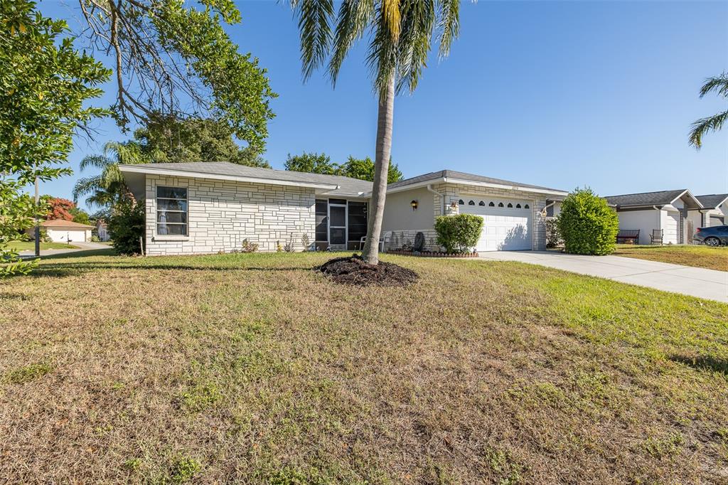 8015 San Fernando Drive Port Richey, FL 34668 - Photo 5 of 46 a view of a house with a yard