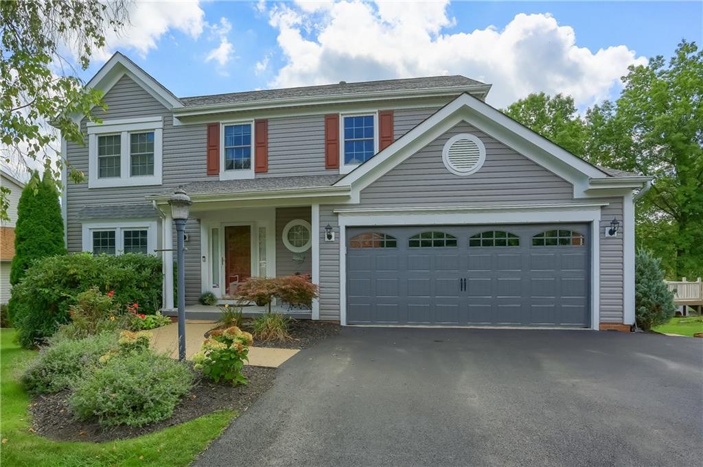 105 Blue Ridge Drive Cranberry Township, PA 16066 - Photo 1 of 50 a front view of a house with a garden and parking