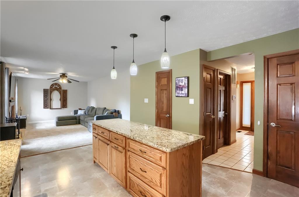 105 Blue Ridge Drive Cranberry Township, PA 16066 - Photo 11 of 50 a large kitchen with kitchen island a refrigerator a stove a sink a dining table and chairs