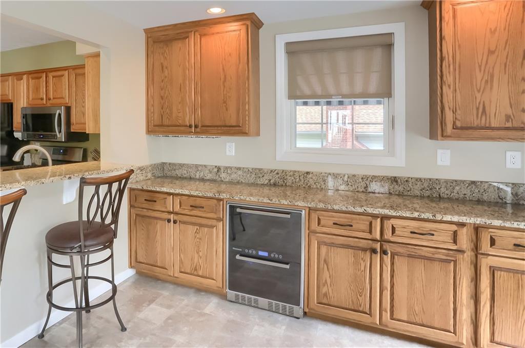 105 Blue Ridge Drive Cranberry Township, PA 16066 - Photo 13 of 50 a kitchen with granite countertop a sink cabinets and window