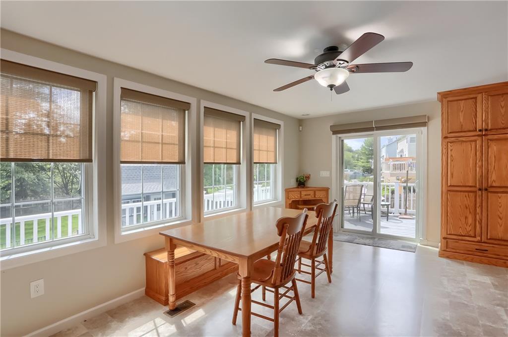 105 Blue Ridge Drive Cranberry Township, PA 16066 - Photo 14 of 50 a dining room with furniture window ceiling fan and wooden floor