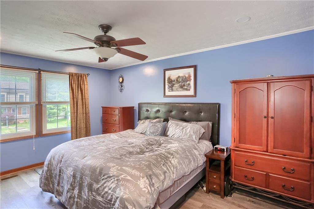 105 Blue Ridge Drive Cranberry Township, PA 16066 - Photo 17 of 50 a bedroom with a large bed and a window