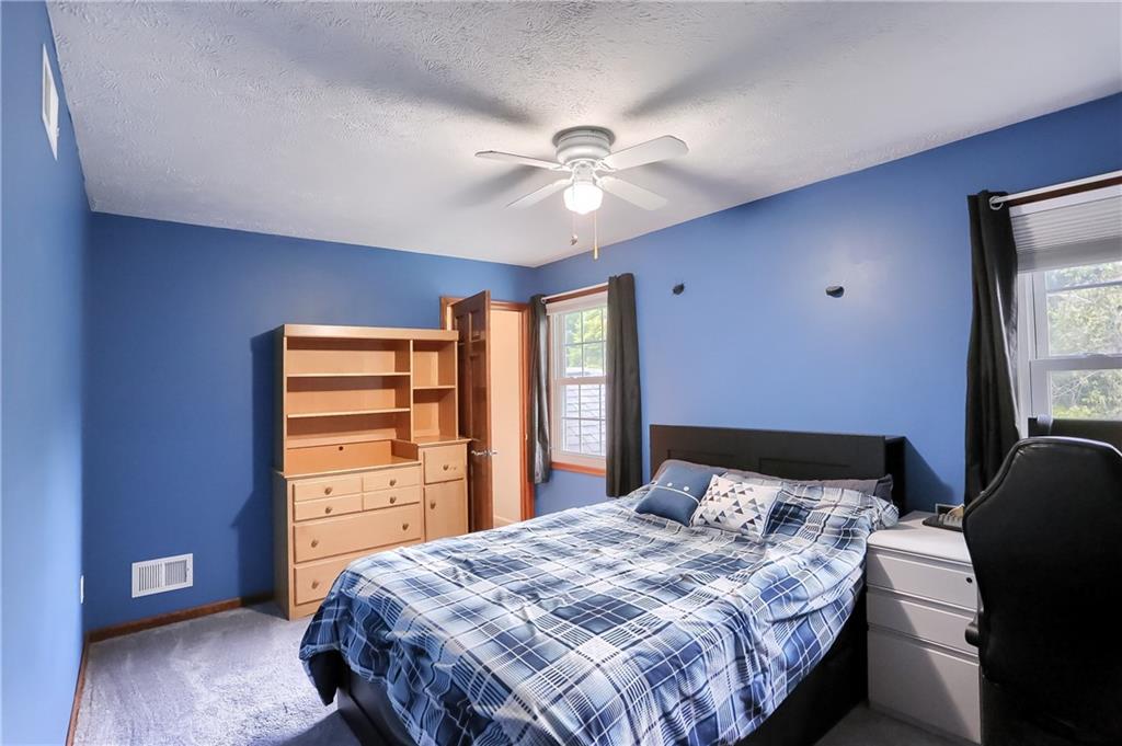 105 Blue Ridge Drive Cranberry Township, PA 16066 - Photo 19 of 50 a bedroom with a bed and a window