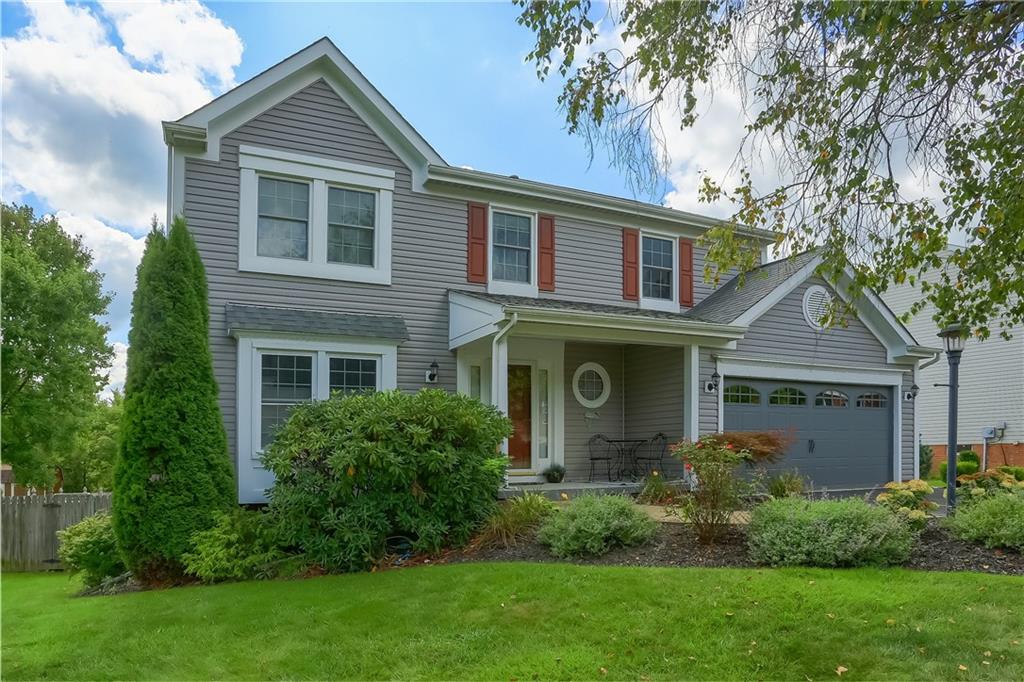105 Blue Ridge Drive Cranberry Township, PA 16066 - Photo 2 of 50 a front view of a house with a yard and trees