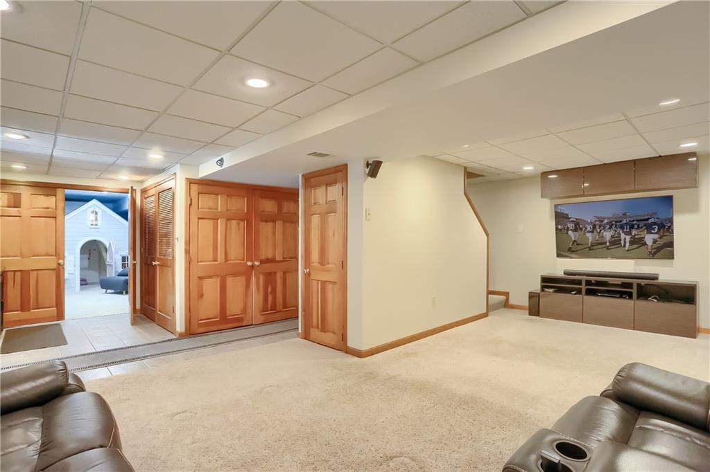 105 Blue Ridge Drive Cranberry Township, PA 16066 - Photo 27 of 50 a view of a livingroom with furniture and a ceiling fan