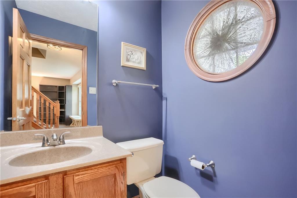105 Blue Ridge Drive Cranberry Township, PA 16066 - Photo 4 of 50 a bathroom with a toilet a sink and mirror