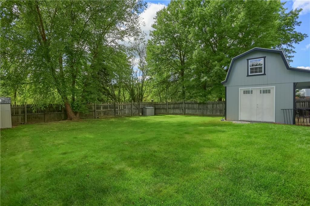 105 Blue Ridge Drive Cranberry Township, PA 16066 - Photo 49 of 50 a view of a backyard with a garden