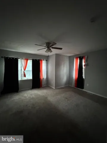 a view of empty room with windows