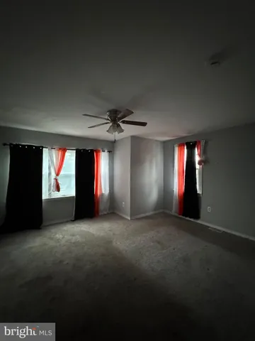 a view of empty room with windows