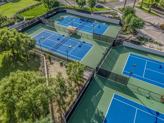 a view of a backyard with sitting area