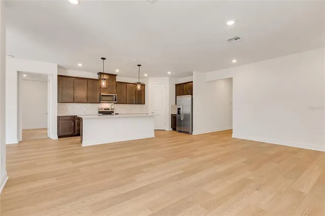 a view of a kitchen with a sink and a microwave