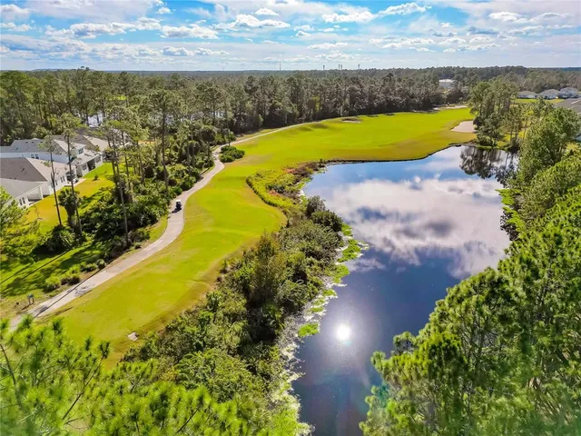 a view of a lake with a yard