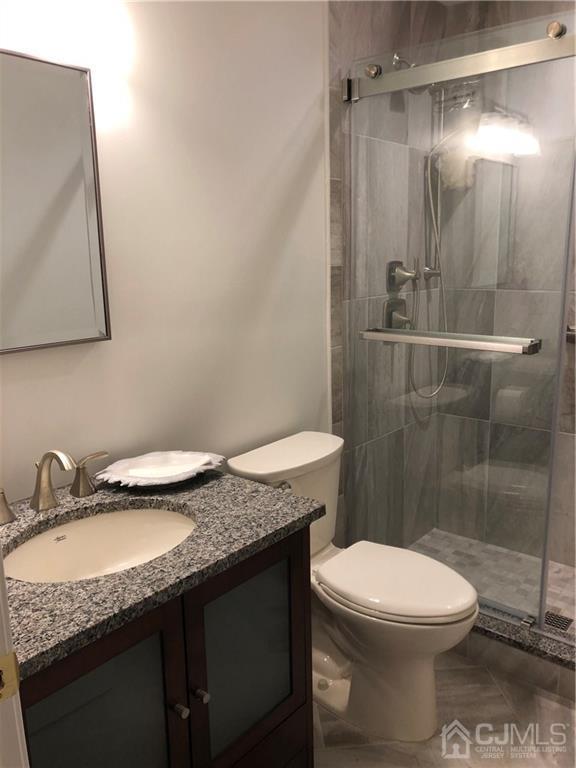 564 B Ardmore Road Monroe Township, NJ 08831 - Photo 11 of 26 a bathroom with a granite countertop sink toilet and shower